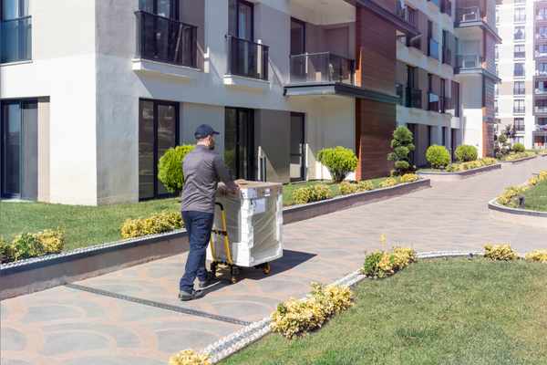 iStock Credit: sefa ozel An appliance deliverer hauling a dishwasher